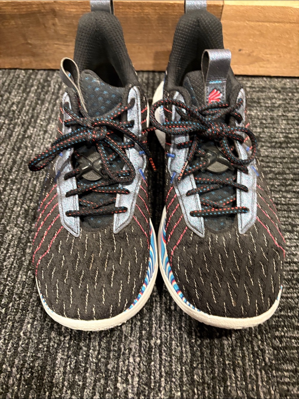 Under Armour Black Sneakers with Blue and Pink Accents